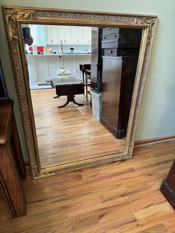 Vintage Beveled Wall Mirror Featuring a Carved Wooden Gold Gilt Frame