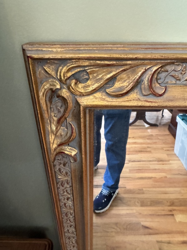 Vintage Beveled Wall Mirror Featuring a Carved Wooden Gold Gilt Frame
